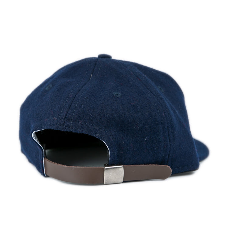 The Fresno State University 1958 Vintage Ballcap by Ebbets Field Flannels, crafted in genuine navy wool, is shown from the back with a brown adjustable strap and silver buckle against a plain white background.