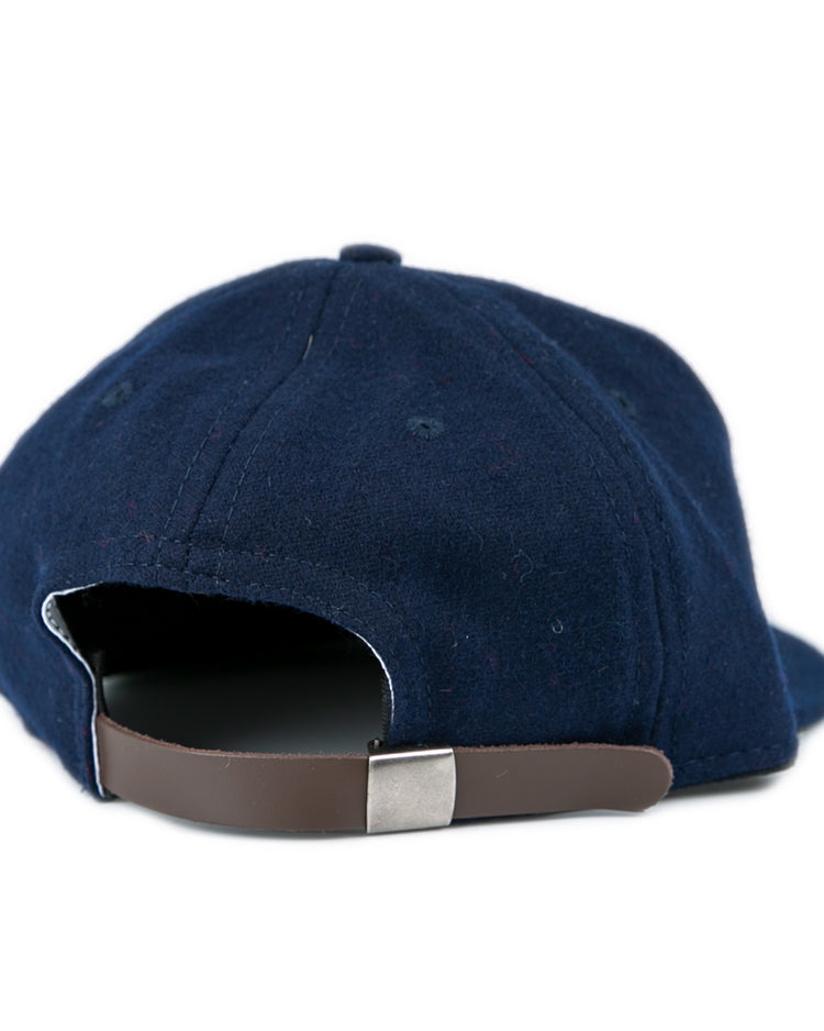 The Fresno State University 1958 Vintage Ballcap by Ebbets Field Flannels, crafted in genuine navy wool, is shown from the back with a brown adjustable strap and silver buckle against a plain white background.