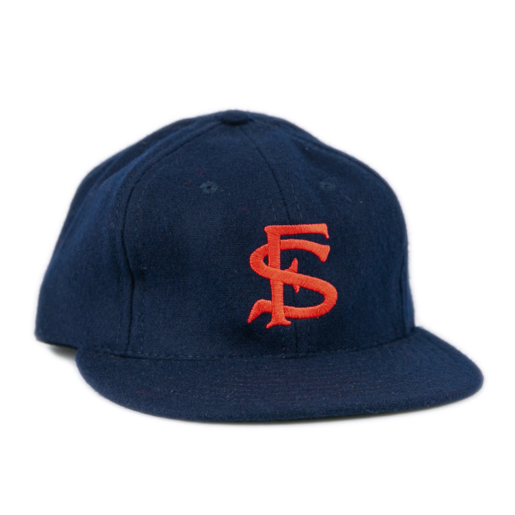 The Ebbets Field Flannels Fresno State University 1958 Vintage Ballcap is a navy genuine wool cap with red SF embroidery, a flat brim, and classic structured design.
