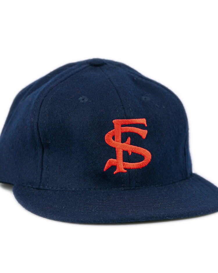 The Ebbets Field Flannels Fresno State University 1958 Vintage Ballcap is a navy genuine wool cap with red SF embroidery, a flat brim, and classic structured design.