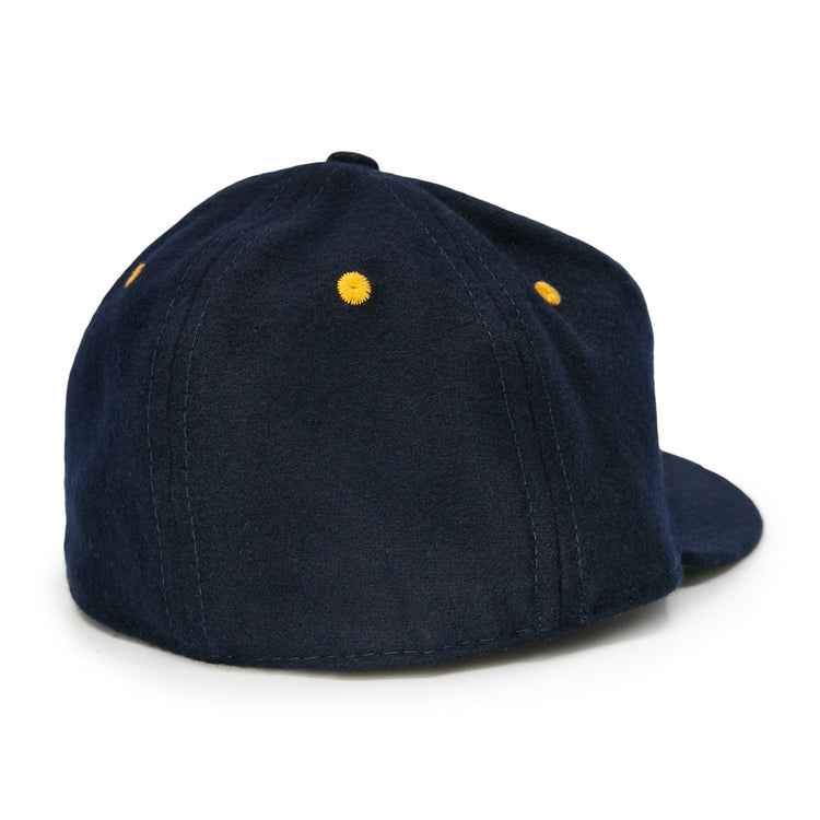 The EFF Great Lakes Naval Station 1944 Vintage Ballcap is shown from the back, showcasing navy wool, yellow embroidered eyelets on each panel, and visible stitching.