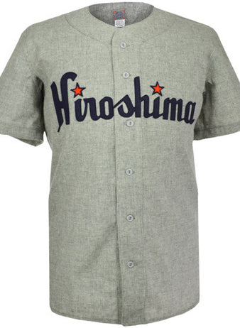 The EFF Hiroshima Carp 1953 Road Jersey is a gray baseball flannel with Hiroshima in navy script and red stars dotting each i. This Japan Central League jersey features short sleeves and a button-down front.