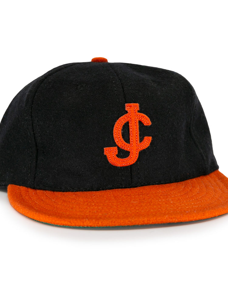 The EFF Jersey City Skeeters 1928 Vintage Ballcap features a black body, orange brim, and an embroidered orange JC logo—ideal for fans after a classic look.