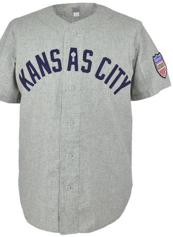 The EFF Kansas City Blues 1951 Road Jersey is a gray button-up with KANSAS CITY in navy across the chest and a colorful circular patch on the left sleeve, inspired by Mickey Mantle’s legendary jersey.