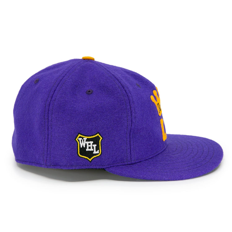 The EFF Los Angeles Monarchs 1947 Vintage Ballcap is a purple wool hat with a yellow crown logo on the side, a black and yellow WFL shield patch, flat brim, and yellow top button detail.