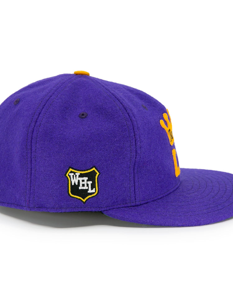 The EFF Los Angeles Monarchs 1947 Vintage Ballcap is a purple wool hat with a yellow crown logo on the side, a black and yellow WFL shield patch, flat brim, and yellow top button detail.