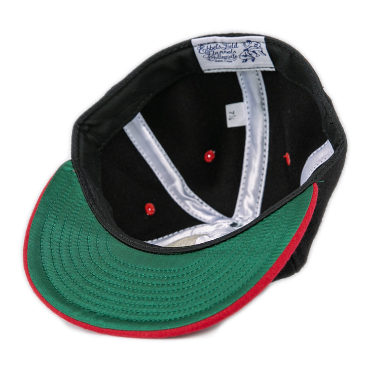 The EFF University of Maryland 1939 Vintage Ballcap in black is shown inside out, displaying a green brim underside with a red edge, red stitching details, and a white inner label with text.