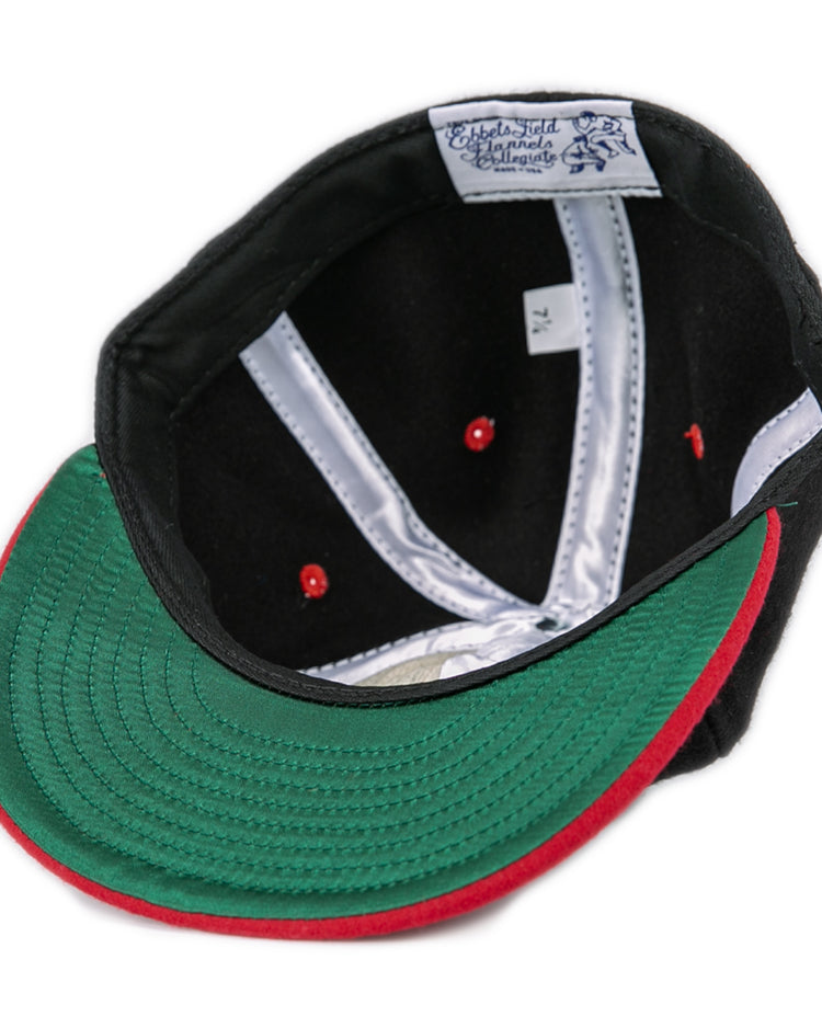 The EFF University of Maryland 1939 Vintage Ballcap in black is shown inside out, displaying a green brim underside with a red edge, red stitching details, and a white inner label with text.