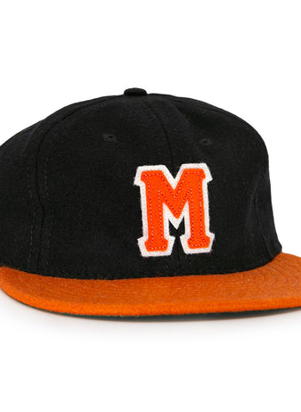 The Marianao Tigres 1950 Vintage Ballcap by Ebbets Field Flannels features a black crown, orange brim, and striking orange M outlined in white, capturing the iconic style of the Cuban Professional League team.