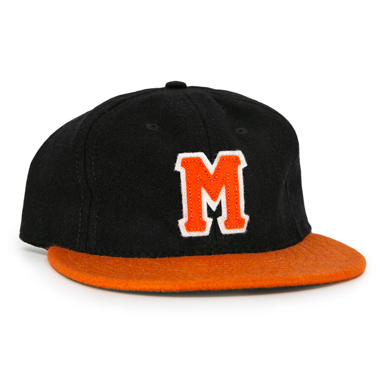 The Marianao Tigres 1950 Vintage Ballcap by Ebbets Field Flannels features a black crown, orange brim, and striking orange M outlined in white, capturing the iconic style of the Cuban Professional League team.