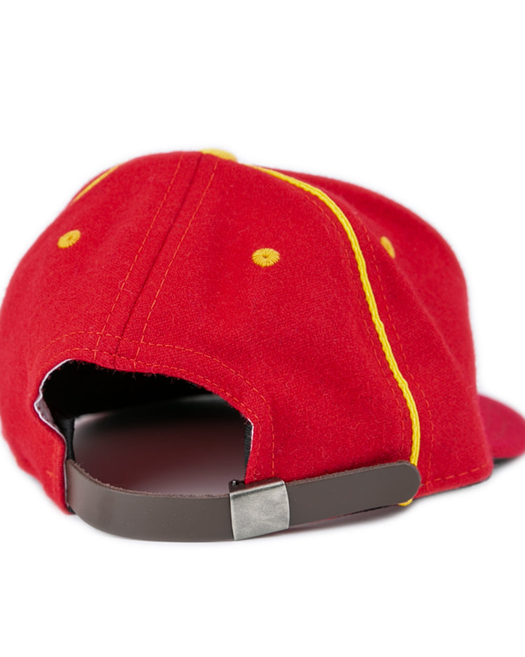 The EFF University of Maryland 1962 Vintage Ballcap in red features yellow stitching, yellow accents, and a brown adjustable strap with a silver clasp. Shown from the back against a plain white background.