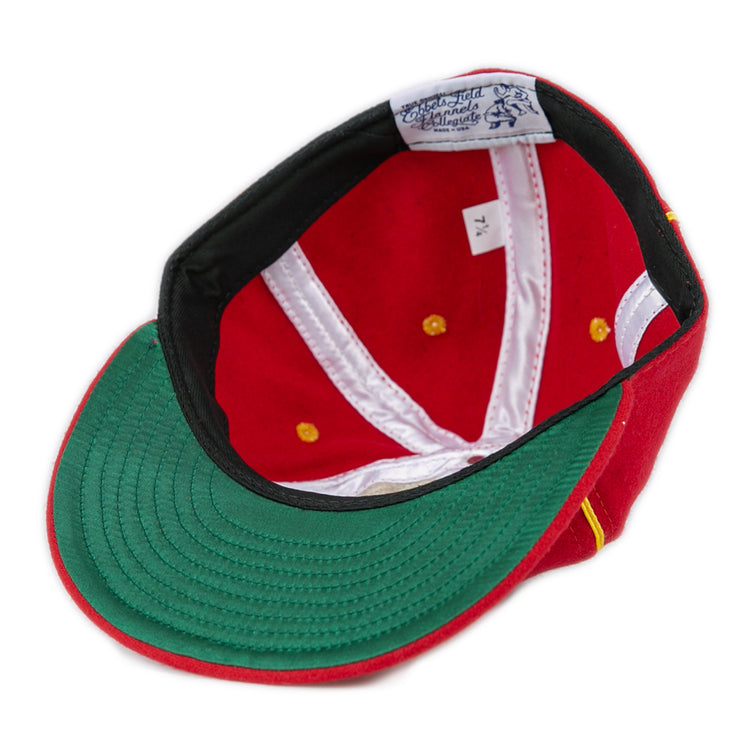 The EFF University of Maryland 1962 Vintage Ballcap is turned upside down, revealing a green underbrim, white inner lining with gold accents, genuine wool material, and a size tag marked 7 1/4.