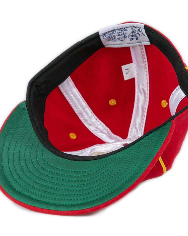 The EFF University of Maryland 1962 Vintage Ballcap is turned upside down, revealing a green underbrim, white inner lining with gold accents, genuine wool material, and a size tag marked 7 1/4.