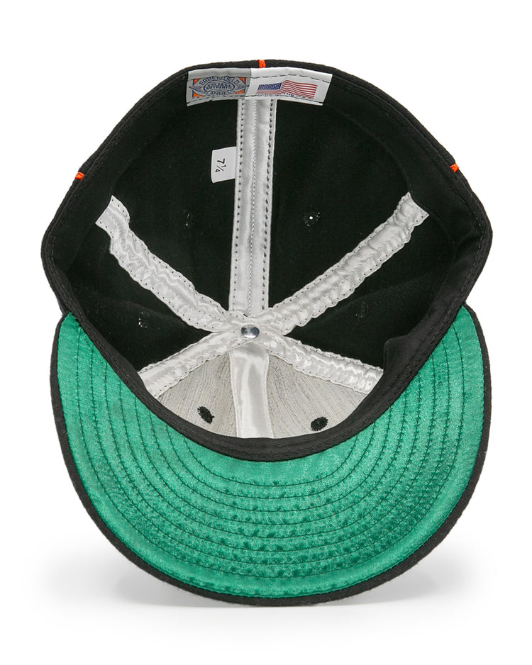 Inside view of the EFF Montreal Black Panthers 1936 Vintage Ballcap shows a green underbrim, white seams, and size 7 1/4 label, plus Made in USA and Genuine Merchandise tags reflecting its classic Quebec Provincial League roots.