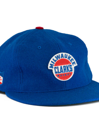 The EFF Milwaukee Clarks Vintage Ballcap is a blue wool cap with Milwaukee Clarks Hockey embroidered on the front and an IHL patch on the side—ideal for hockey fans and collectors.