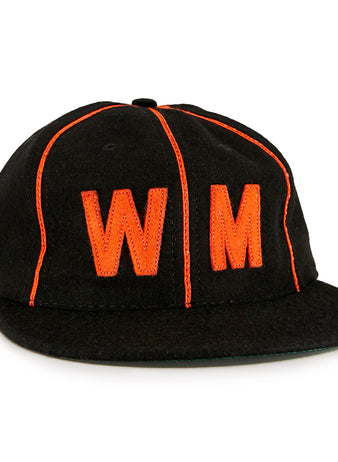 The EFF Wichita Monrovians 1925 Vintage Ballcap is a black cap with bright orange piping and a large orange embroidered WM on the front, inspired by the classic teams original design.