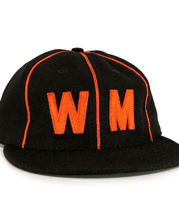 The EFF Wichita Monrovians 1925 Vintage Ballcap is a black cap with bright orange piping and a large orange embroidered WM on the front, inspired by the classic teams original design.