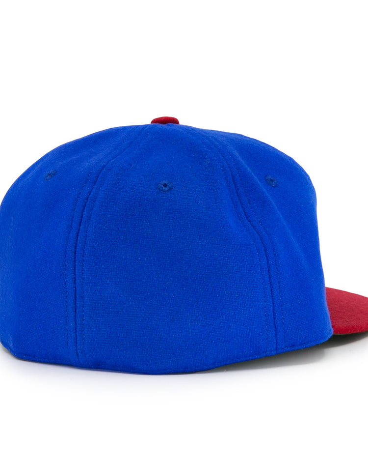The EFF Montreal Royals 1935 Vintage Ballcap features a blue crown and red brim, shown from the back and at an angle on a white background, capturing the classic style of the original 1935 ballcap.