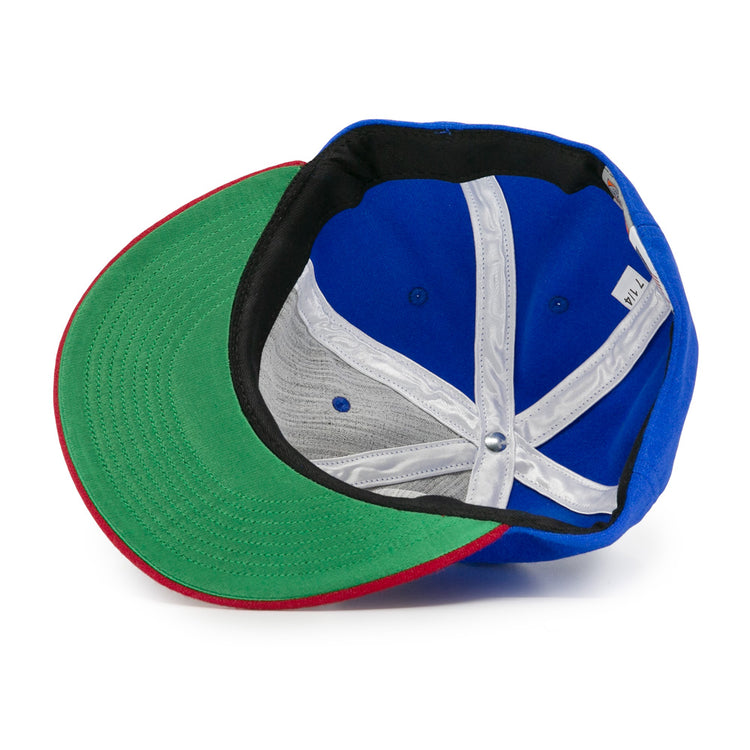 The EFF Montreal Royals 1935 Vintage Ballcap features a green brim, red edge, black inner band, white inside seams, and a visible size label—all viewed from underneath for authentic vintage style.