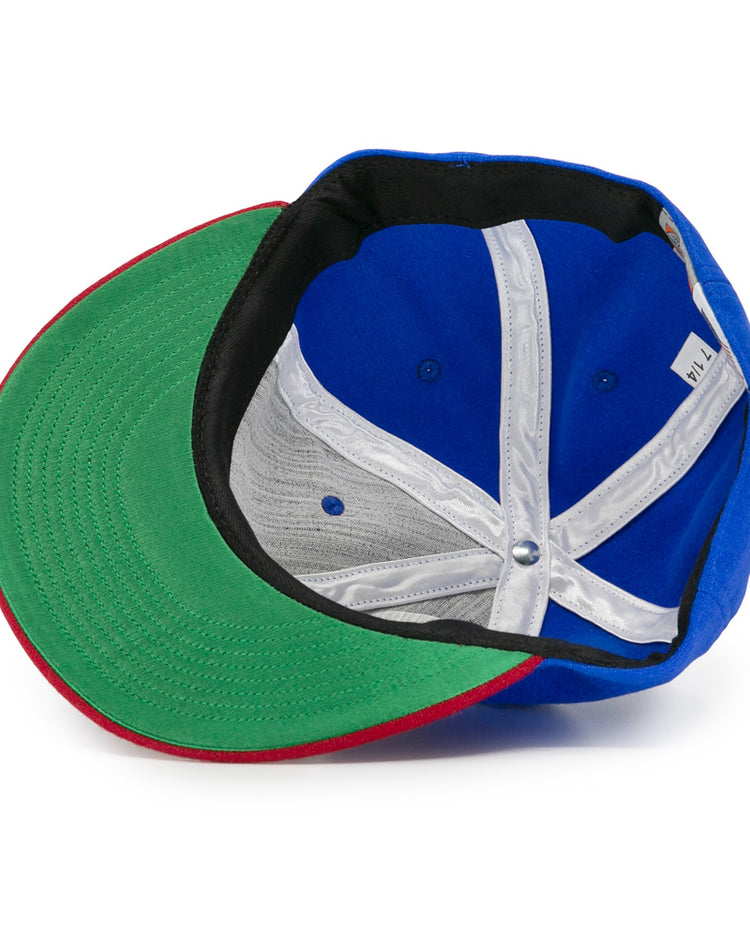 The EFF Montreal Royals 1935 Vintage Ballcap features a green brim, red edge, black inner band, white inside seams, and a visible size label—all viewed from underneath for authentic vintage style.