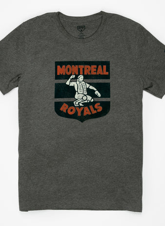 The EFF Montreal Royals 1946 T-Shirt is heather gray with a vintage-style catcher logo in white and orange on the chest, celebrating Dodgers prospect history, plus a small dark graphic on the left sleeve.