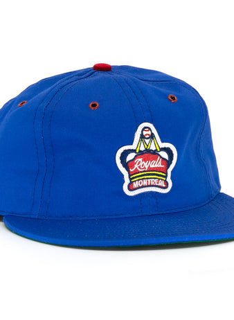The EFF Montreal Royals Cotton Twill Ballcap features royal blue fabric, a red top button and eyelets, plus an embroidered Montreal Royals logo patch on the front, honoring Jackie Robinsons legacy.