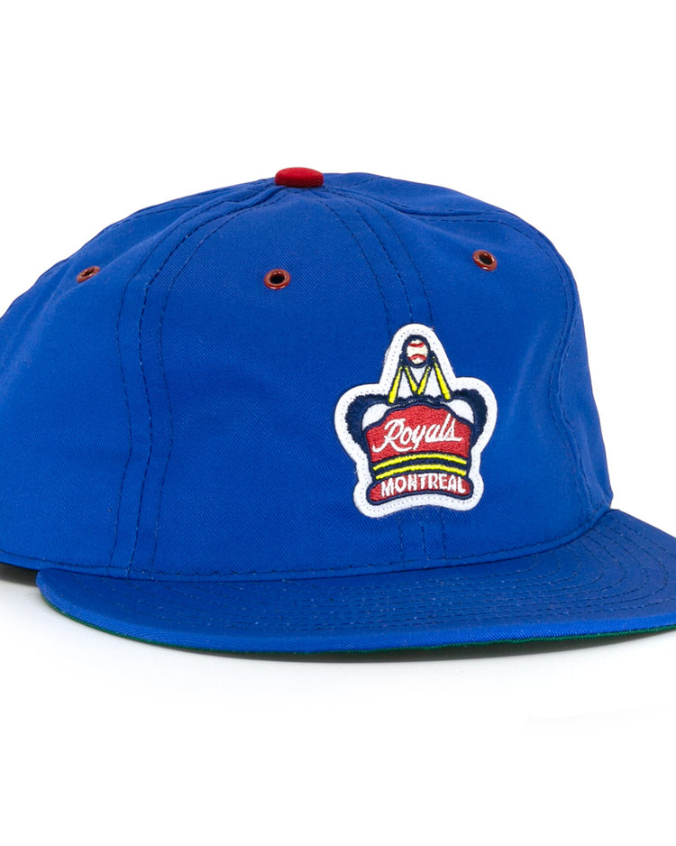 The EFF Montreal Royals Cotton Twill Ballcap features royal blue fabric, a red top button and eyelets, plus an embroidered Montreal Royals logo patch on the front, honoring Jackie Robinsons legacy.