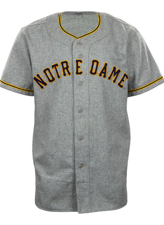 The EFF University of Notre Dame 1956 Road Jersey is a gray authentic jersey with NOTRE DAME in bold black and gold, plus matching trim—perfect for fans wanting a classic collegiate team look.