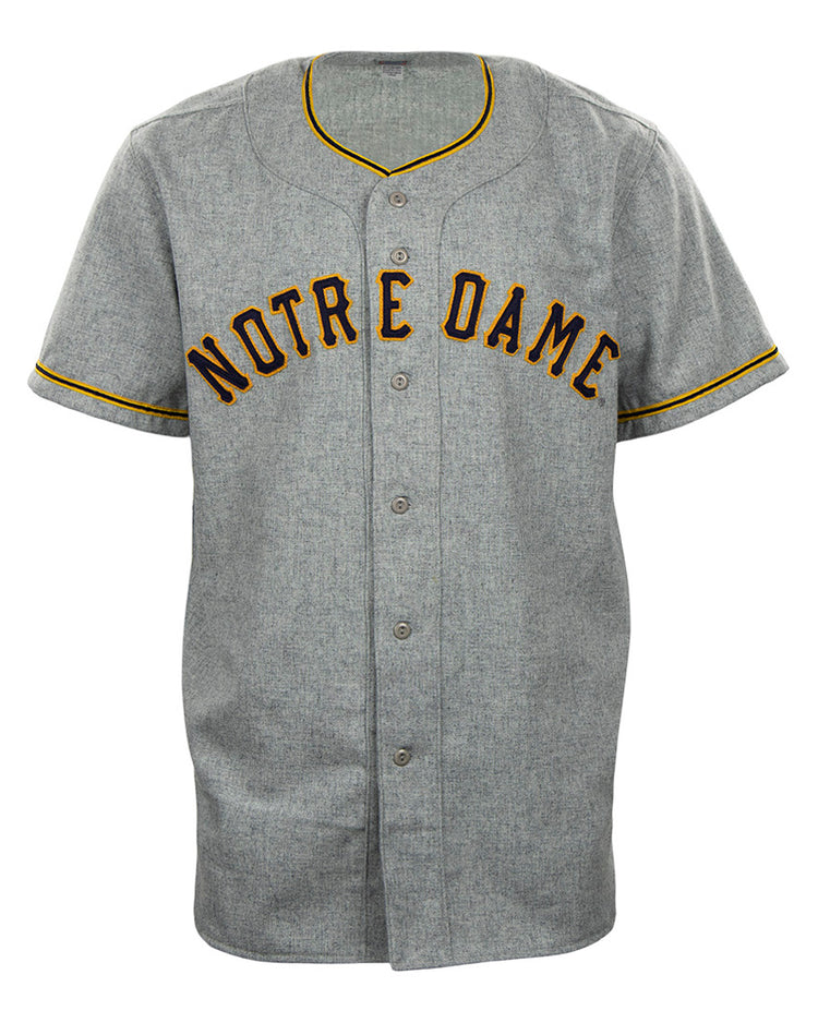 The EFF University of Notre Dame 1956 Road Jersey is a gray authentic jersey with NOTRE DAME in bold black and gold, plus matching trim—perfect for fans wanting a classic collegiate team look.