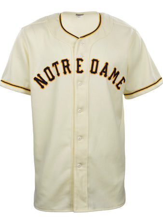 The EFF University of Notre Dame 1956 Home Jersey is a vintage-style cream flannel baseball jersey with black and gold trim and bold Notre Dame lettering across the chest, inspired by the 1956 button-down original.