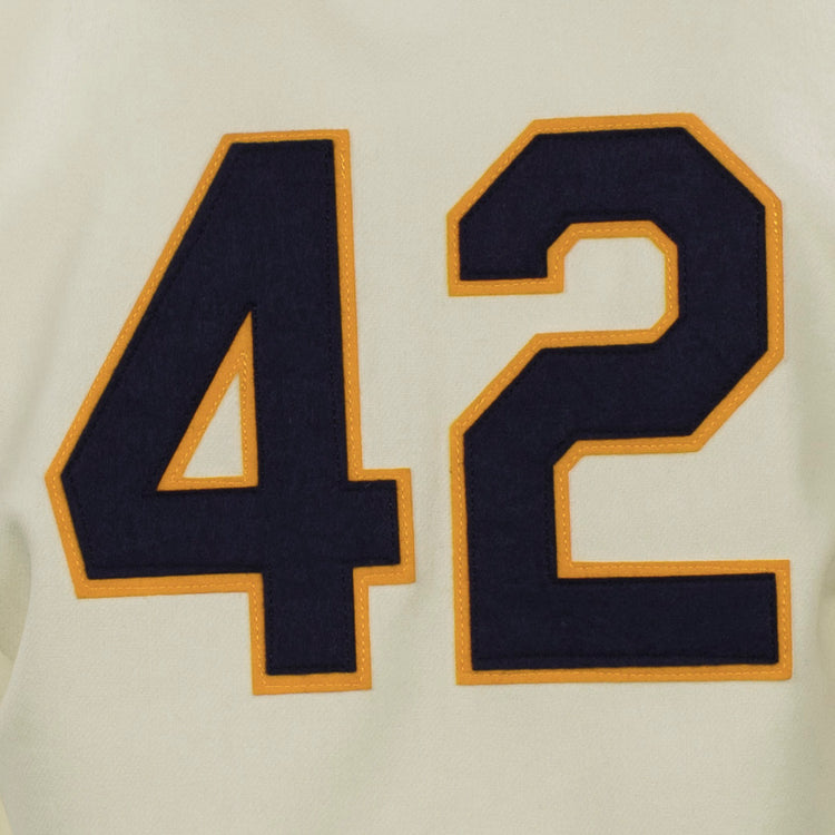 Featuring the number 42 in bold black with a gold outline on cream fabric, the EFF University of Notre Dame 1956 Home Jersey captures the authentic look of classic flannel baseball uniforms.