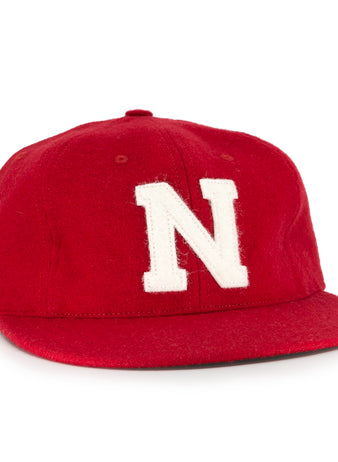The Ebbets Field Flannels University of Nebraska 1958 Vintage Ballcap features a red wool design with a bold white N—a classic choice for any Huskers fan.