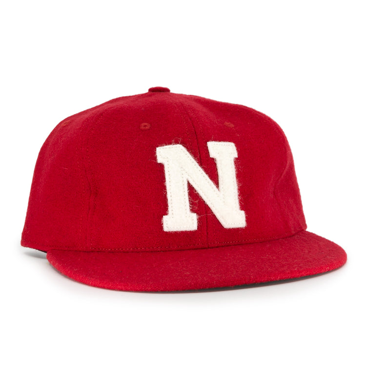 The Ebbets Field Flannels University of Nebraska 1958 Vintage Ballcap features a red wool design with a bold white N—a classic choice for any Huskers fan.