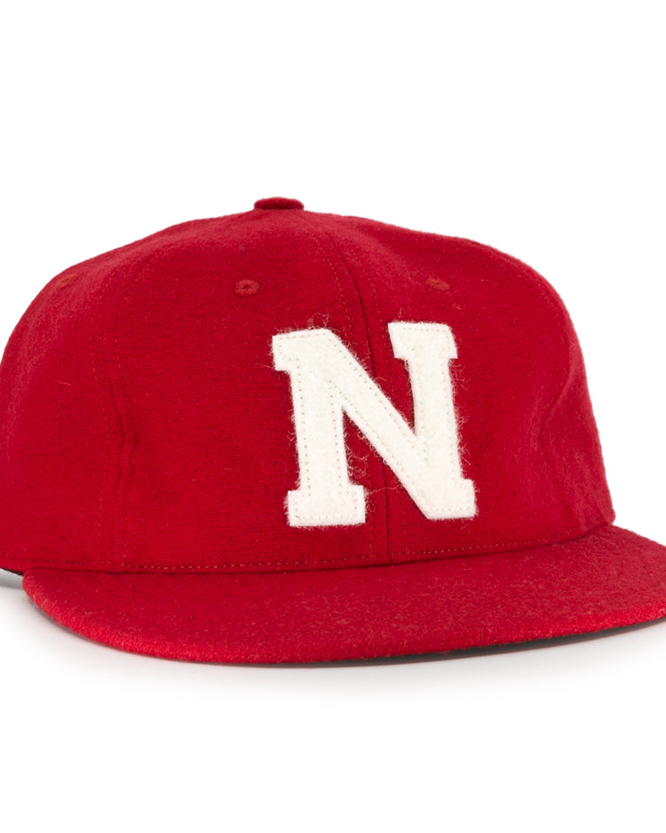 The Ebbets Field Flannels University of Nebraska 1958 Vintage Ballcap features a red wool design with a bold white N—a classic choice for any Huskers fan.
