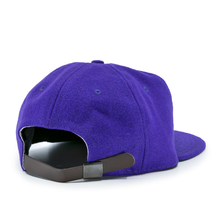 The EFF Northwestern University 1961 Vintage Ballcap is a purple wool cap shown from the back, with a black leather strap and metal clasp, soft textured fabric, curved brim, and is officially licensed.
