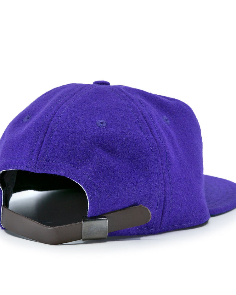 The EFF Northwestern University 1961 Vintage Ballcap is a purple wool cap shown from the back, with a black leather strap and metal clasp, soft textured fabric, curved brim, and is officially licensed.