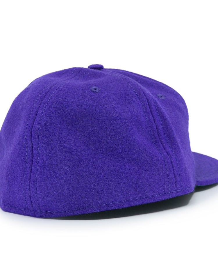 The EFF Northwestern University 1961 Vintage Ballcap is a purple wool cap with a flat brim, seen from the back and side, with no visible logos—perfect for fans who love a timeless, classic look.
