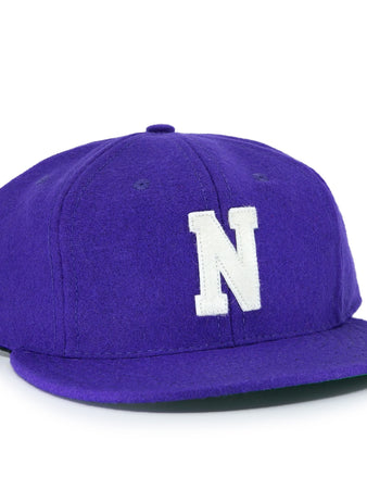 The EFF Northwestern University 1961 Vintage Ballcap is a purple wool flat-brim cap with a large white N embroidered on the front, inspired by the officially licensed college vault design.