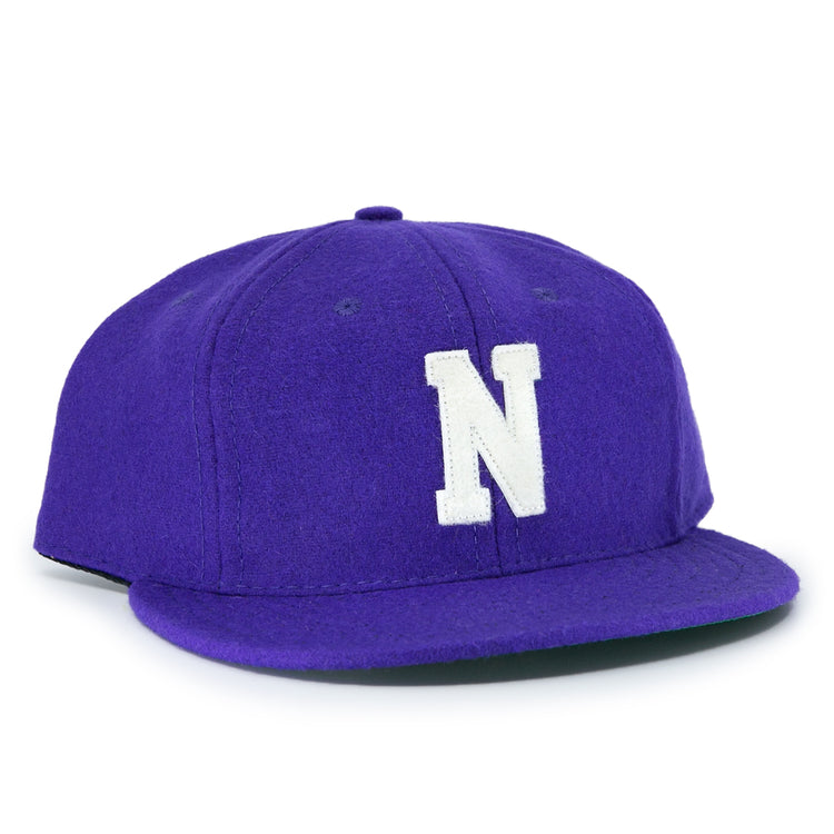 The EFF Northwestern University 1961 Vintage Ballcap is a purple wool flat-brim cap with a large white N embroidered on the front, inspired by the officially licensed college vault design.