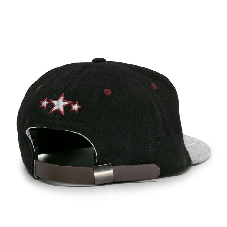 The EFF Nashville Stars 2021 Road Ballcap has a black crown, gray brim, adjustable brown strap, and a small embroidered design with three stars (center white, others red), inspired by classic Negro Leagues styles. Shown from the back.