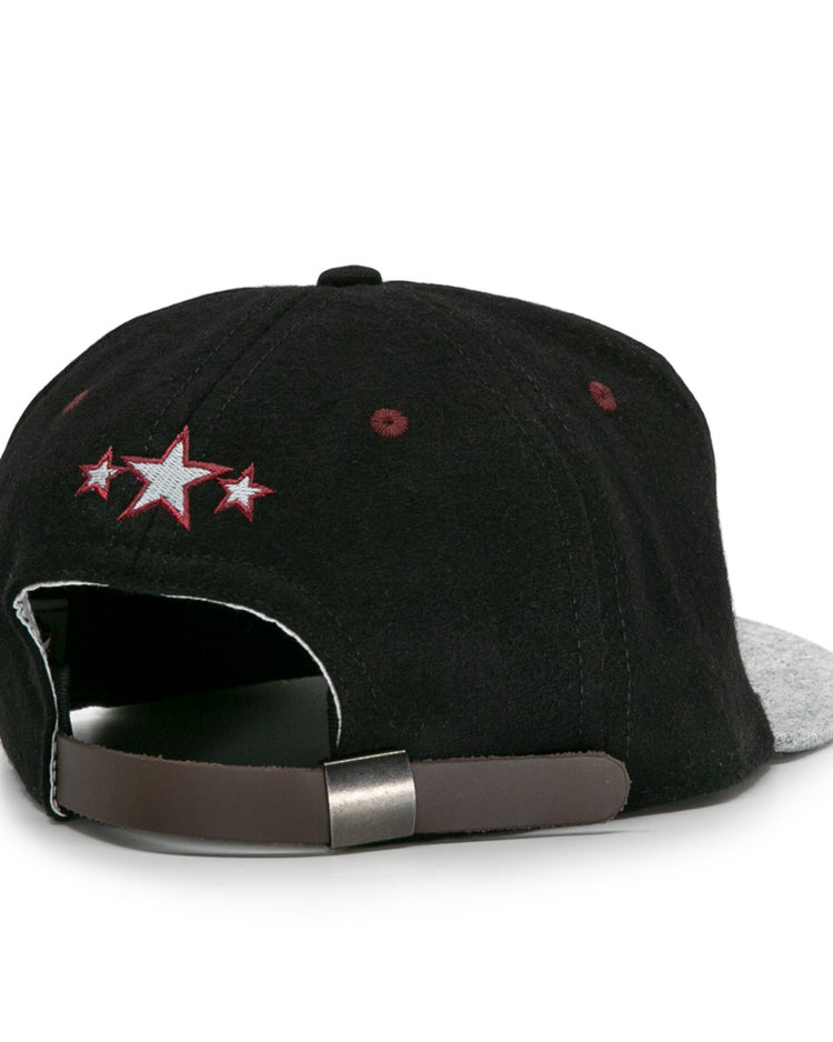 The EFF Nashville Stars 2021 Road Ballcap has a black crown, gray brim, adjustable brown strap, and a small embroidered design with three stars (center white, others red), inspired by classic Negro Leagues styles. Shown from the back.