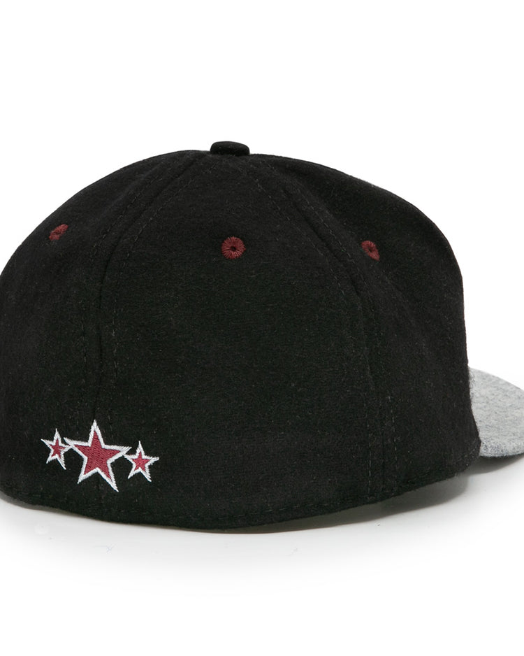 The EFF Nashville Stars 2021 Road Ballcap is shown from the back, featuring a black crown, gray brim, and three embroidered red and white stars near the bottom edge as a tribute to Music City Baseball and the Negro Leagues.