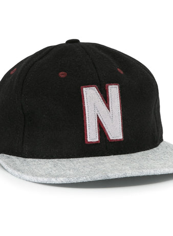 The EFF Nashville Stars 2021 Road Ballcap features a black crown, light gray brim, and a large white “N” with a maroon outline on the front, honoring the legacy of Negro Leagues baseball caps.
