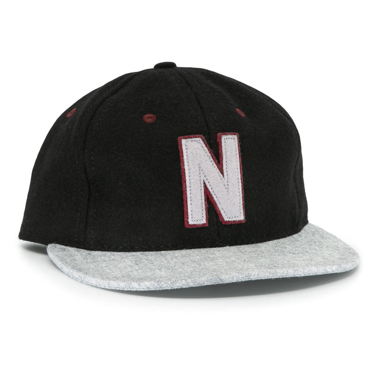 The EFF Nashville Stars 2021 Road Ballcap features a black crown, light gray brim, and a large white “N” with a maroon outline on the front, honoring the legacy of Negro Leagues baseball caps.