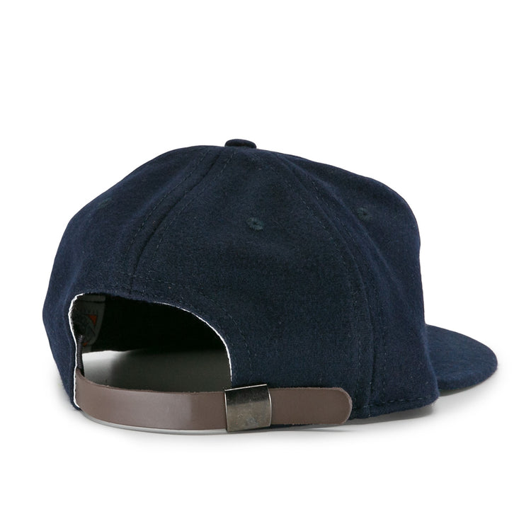 The EFF New York Knights City Series Ballcap is shown from the back in navy blue, featuring a brown adjustable strap with a metal buckle—a vintage style inspired by the classic cap from The Natural movie.
