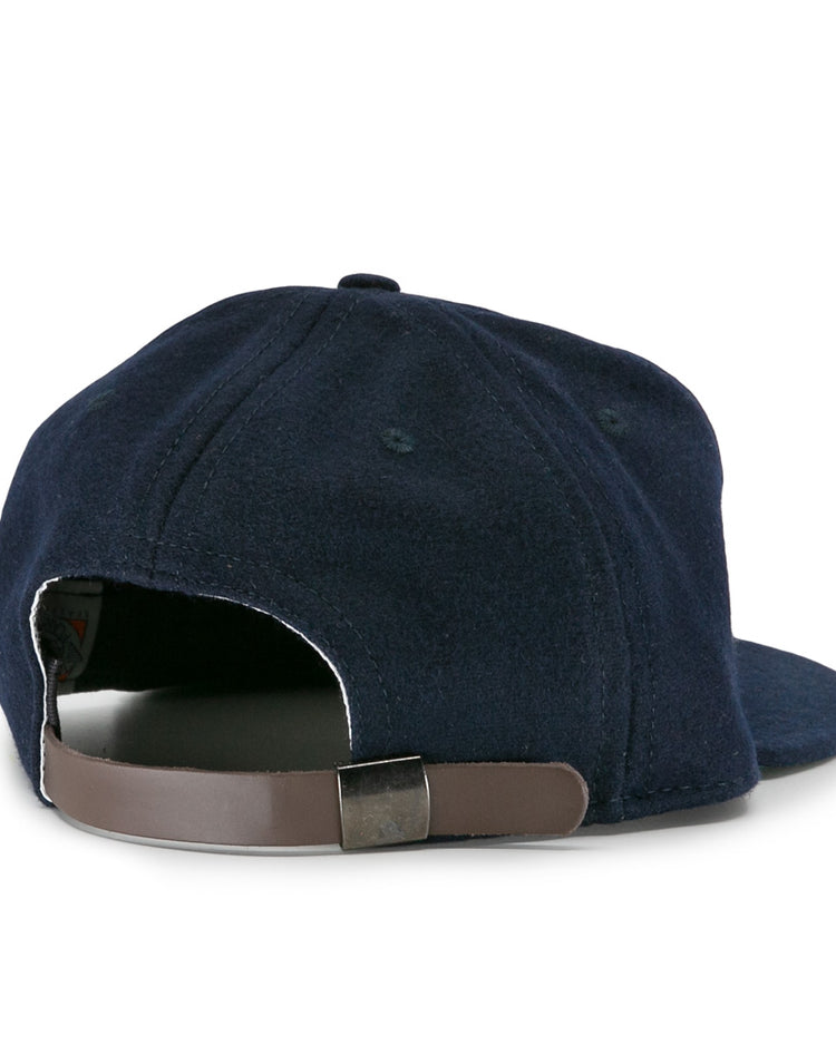 The EFF New York Knights City Series Ballcap is shown from the back in navy blue, featuring a brown adjustable strap with a metal buckle—a vintage style inspired by the classic cap from The Natural movie.