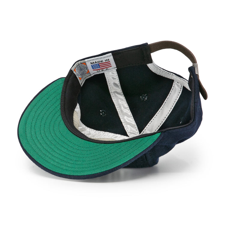 The EFF New York Knights City Series Ballcap features navy blue vintage wool, a green underbrim, white silk lining, brown leather strap, and a Made in USA label—just like the iconic cap from The Natural.