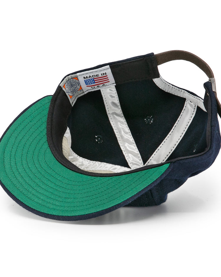 The EFF New York Knights City Series Ballcap features navy blue vintage wool, a green underbrim, white silk lining, brown leather strap, and a Made in USA label—just like the iconic cap from The Natural.