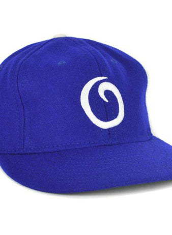The EFF Oakland Oaks 1950 Vintage Ballcap is a royal blue cap featuring a white, stylized “O” on the front, inspired by the classic Pacific Coast League teams design.