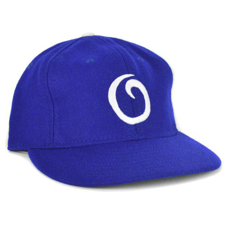 The EFF Oakland Oaks 1950 Vintage Ballcap is a royal blue cap featuring a white, stylized “O” on the front, inspired by the classic Pacific Coast League teams design.